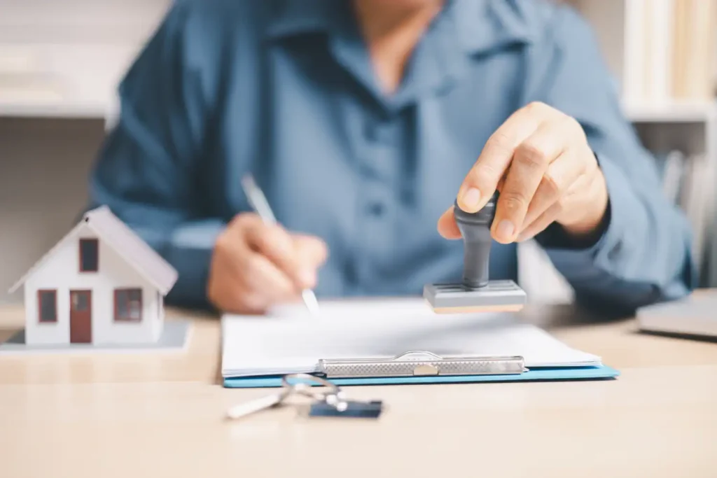 Bridging loans for auction properties — solicitor and buyer reviewing legal documents before auction deadline