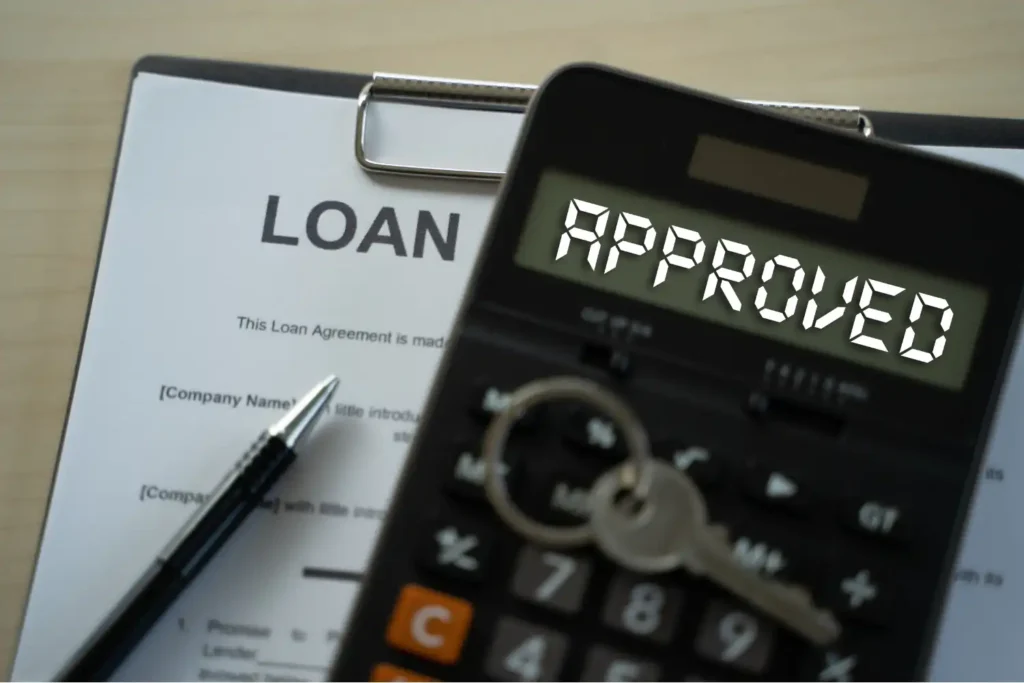 Bridging loan application process timeline — UK property buyer and solicitor reviewing documents showing valuation, legal checks and drawdown stages