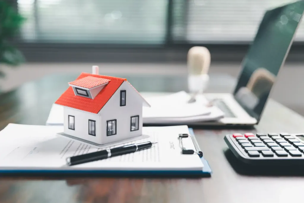 Bridging loan valuation explained — UK property surveyor with clipboard assessing residential property condition and market value for bridging finance lender