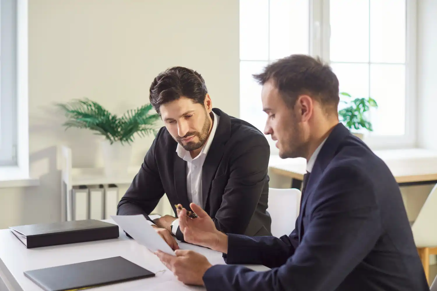 Probate property purchase — executor and buyer discussing bridging loan terms with solicitor